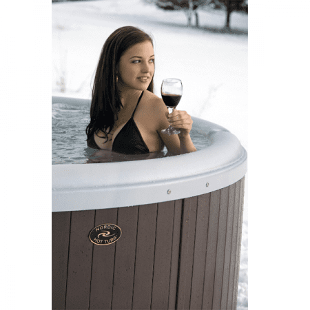 Girl in a hot tub with wine, that is an option when looking to buy hot tub Tinley Park.